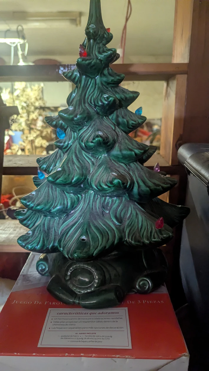 Ceramic Christmas tree with colorful lights, from the Angotti Estate listing