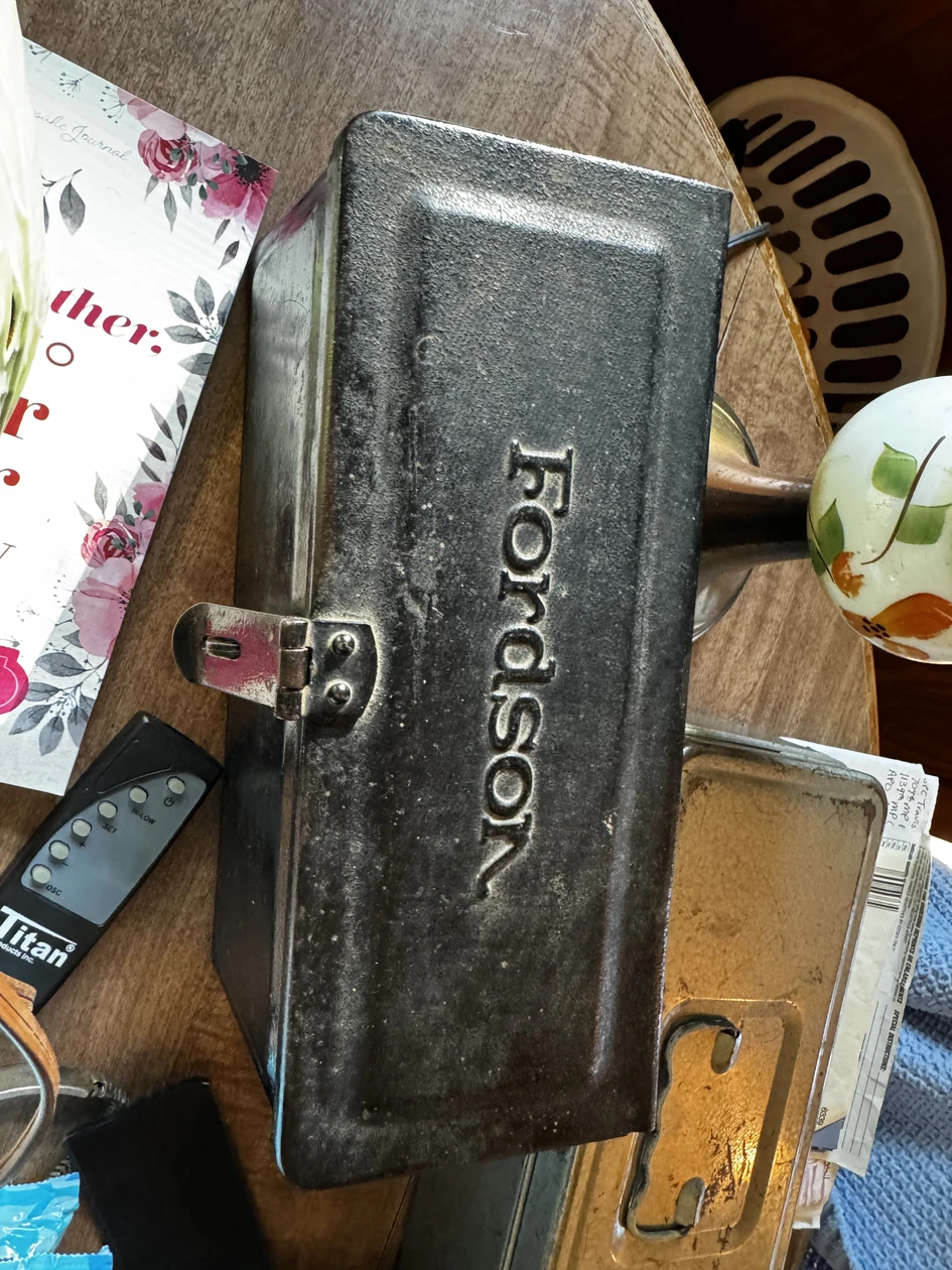 Fordson metal piece among household items