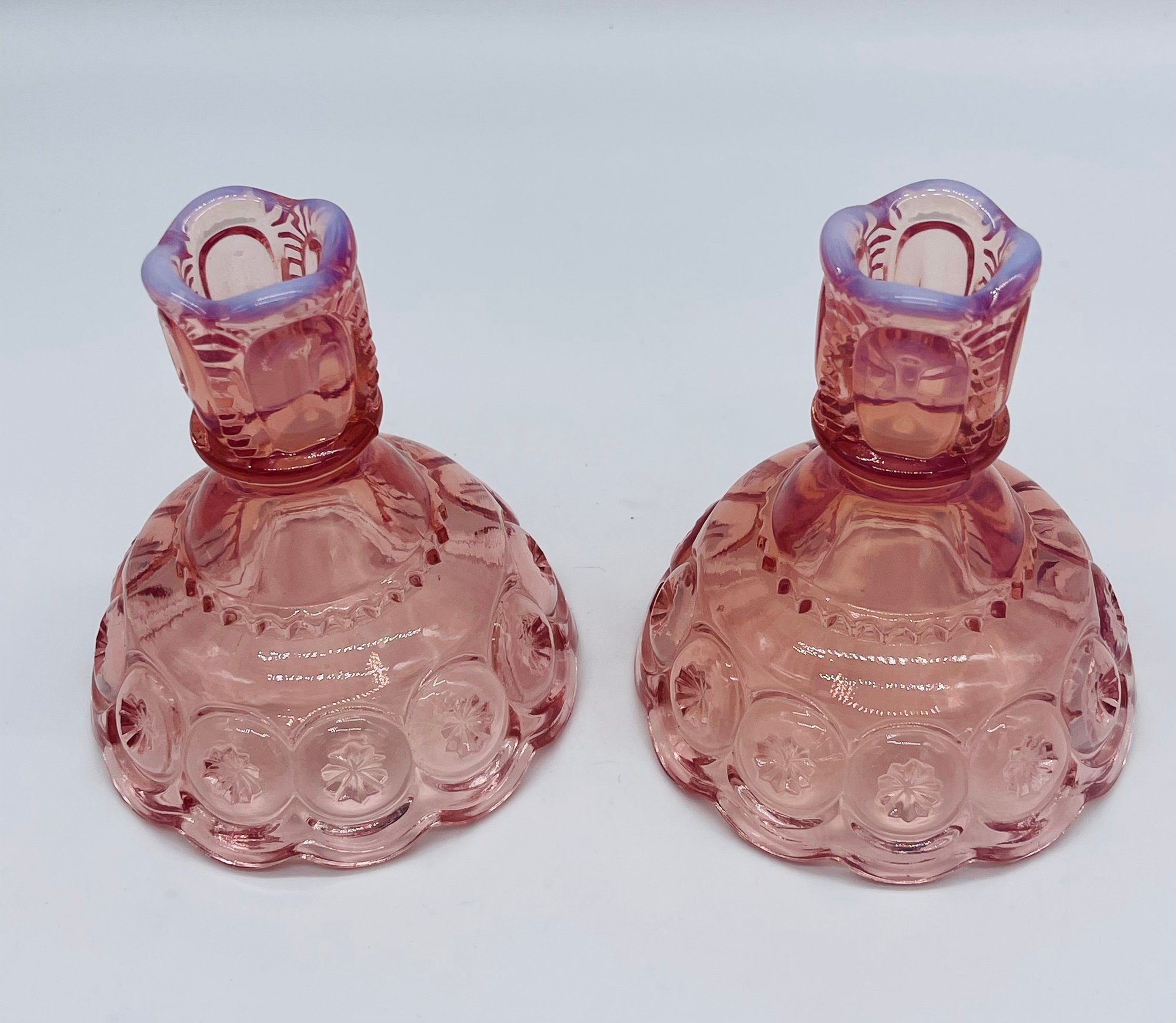Pair of pink pressed glass candleholders