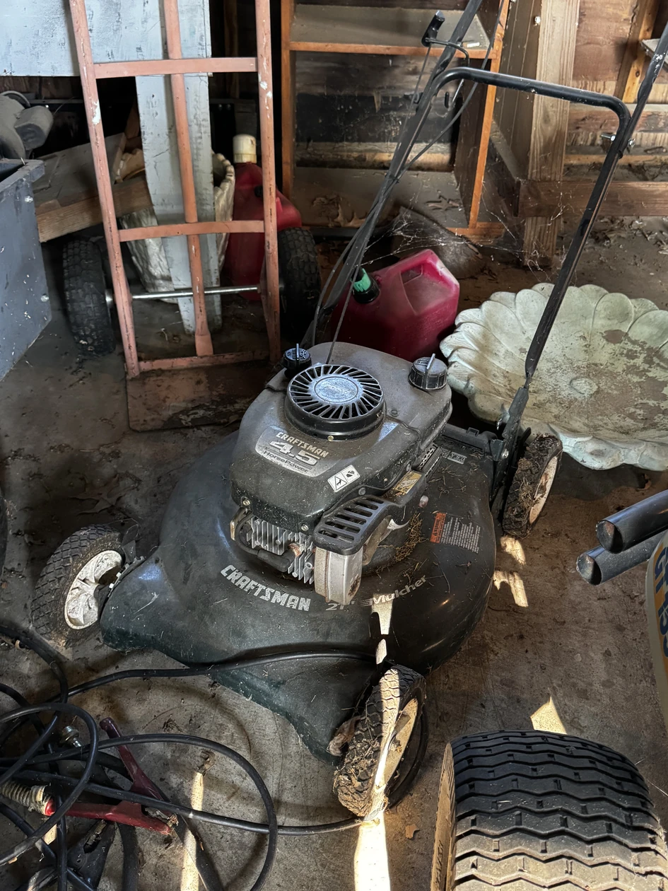 Craftsman push mower in a workshop