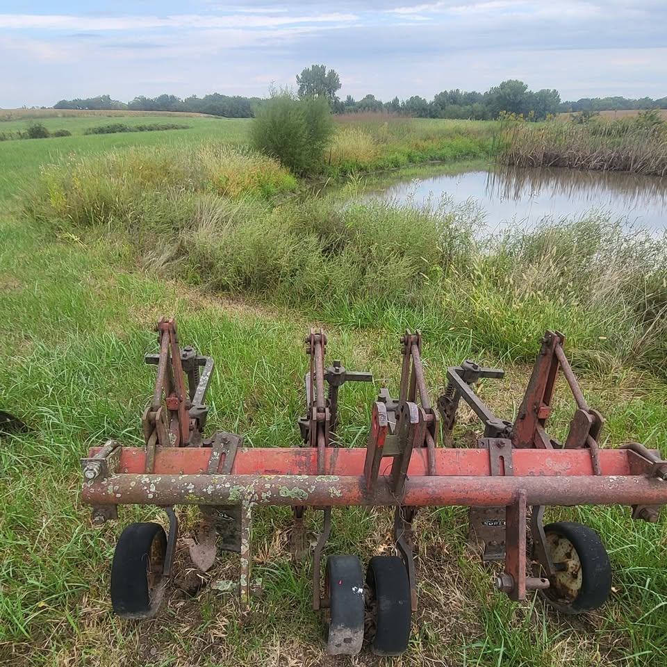 Row cultivator by a pond, photo from the Warnings Auction Service Facebook page