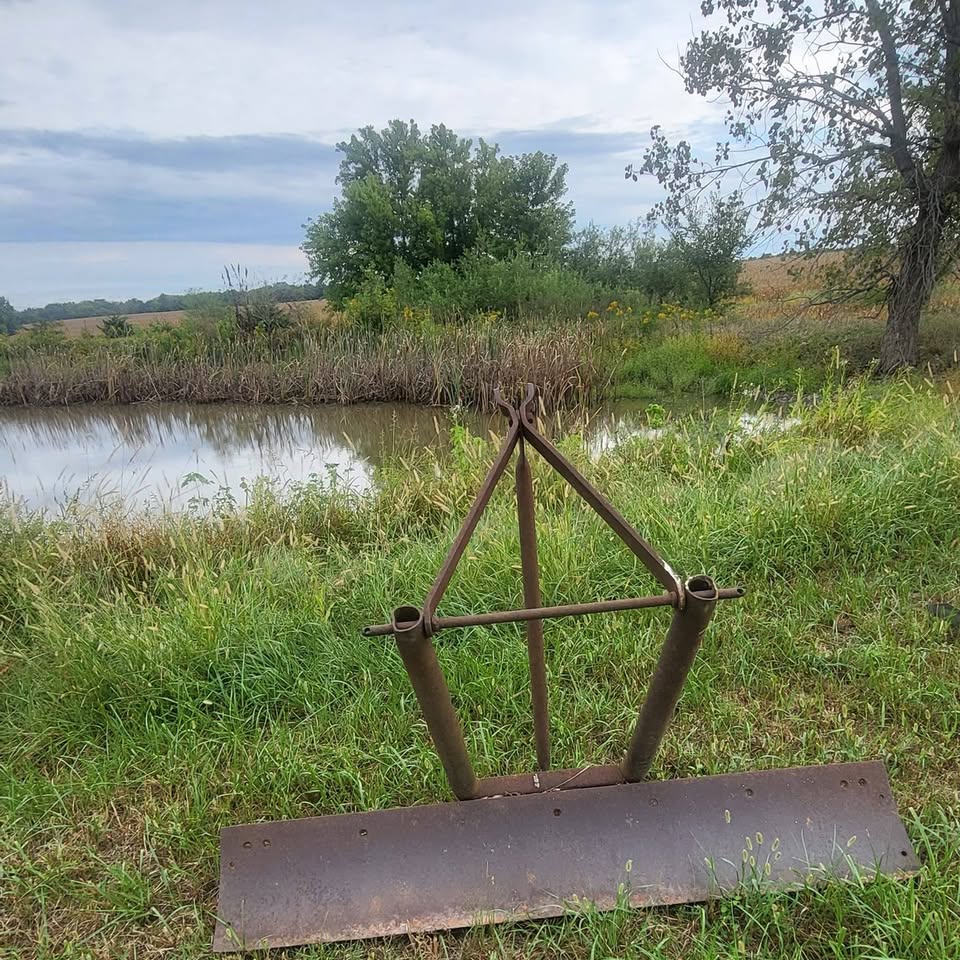Grader blade by a pond, photo from the Warnings Auction Service Facebook page